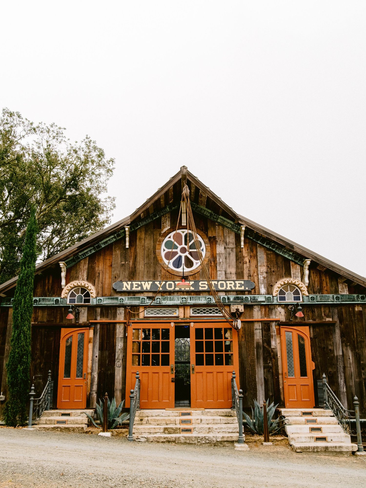 Rustic wooden storefront with 'New York Store' sign and vintage architectural details.