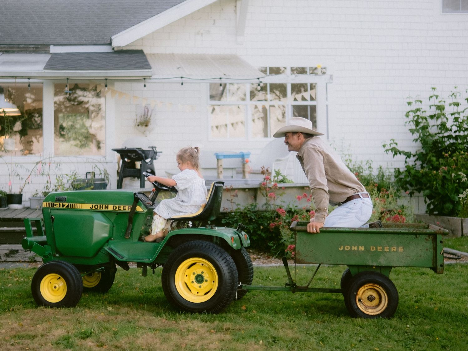 Classic John Deere tractors lined up in a row showing vintage farm equipment.