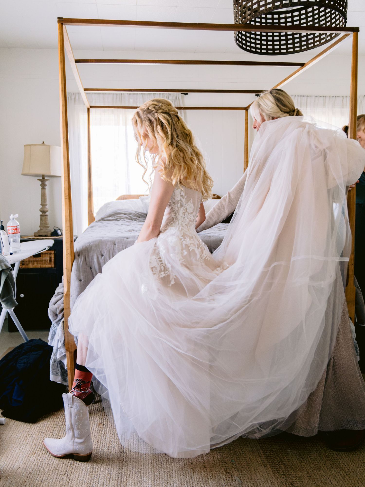 A flowing white wedding dress swirls gracefully across a carpeted floor in a series of artistic shots.