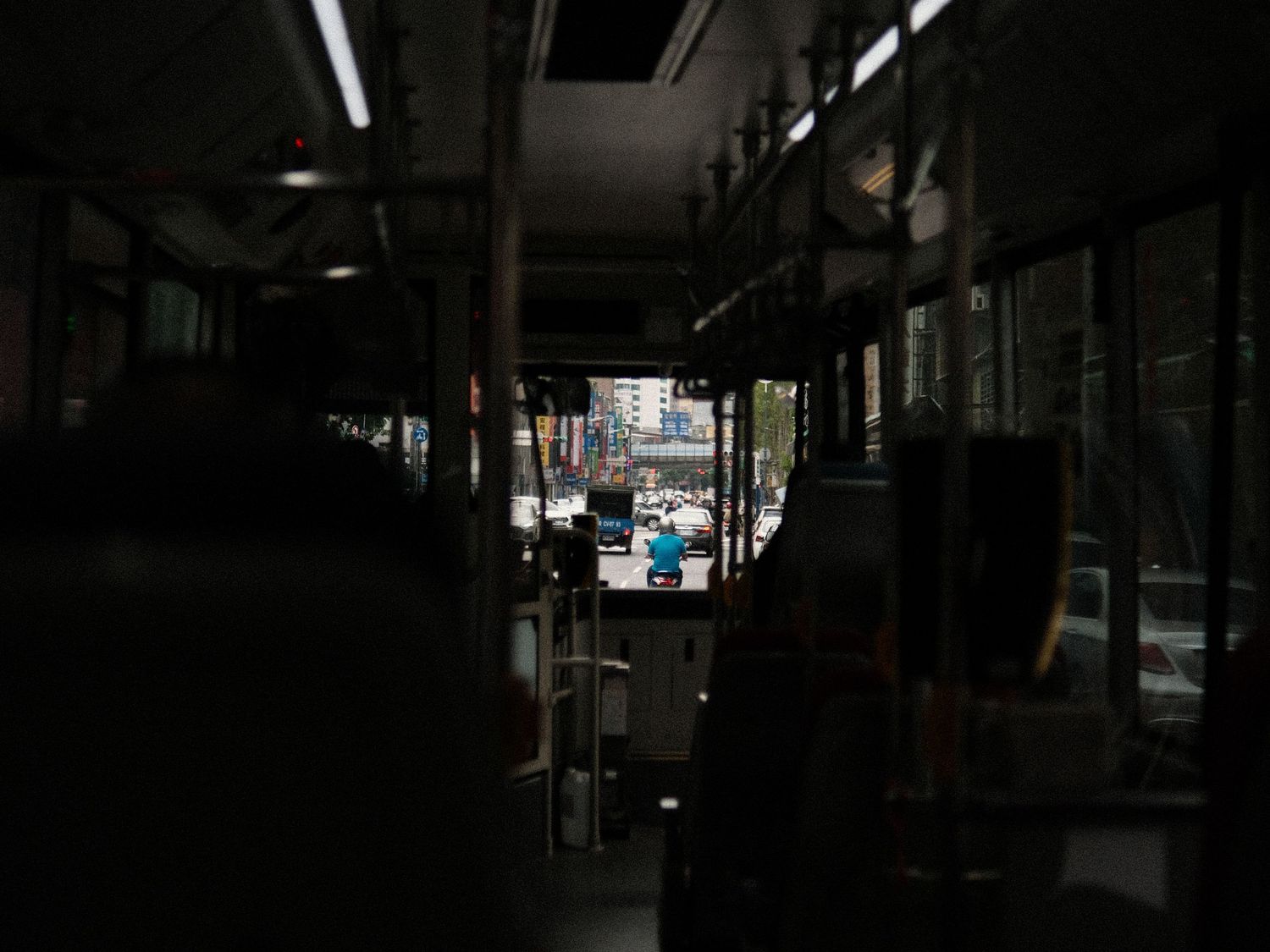 Dark interior view of an empty industrial or commercial space with minimal lighting.