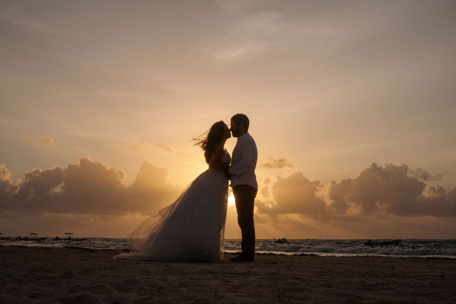Sunrise beach trash the dress session in Tulum. Magical light and love create an unforgettable coastal moment.