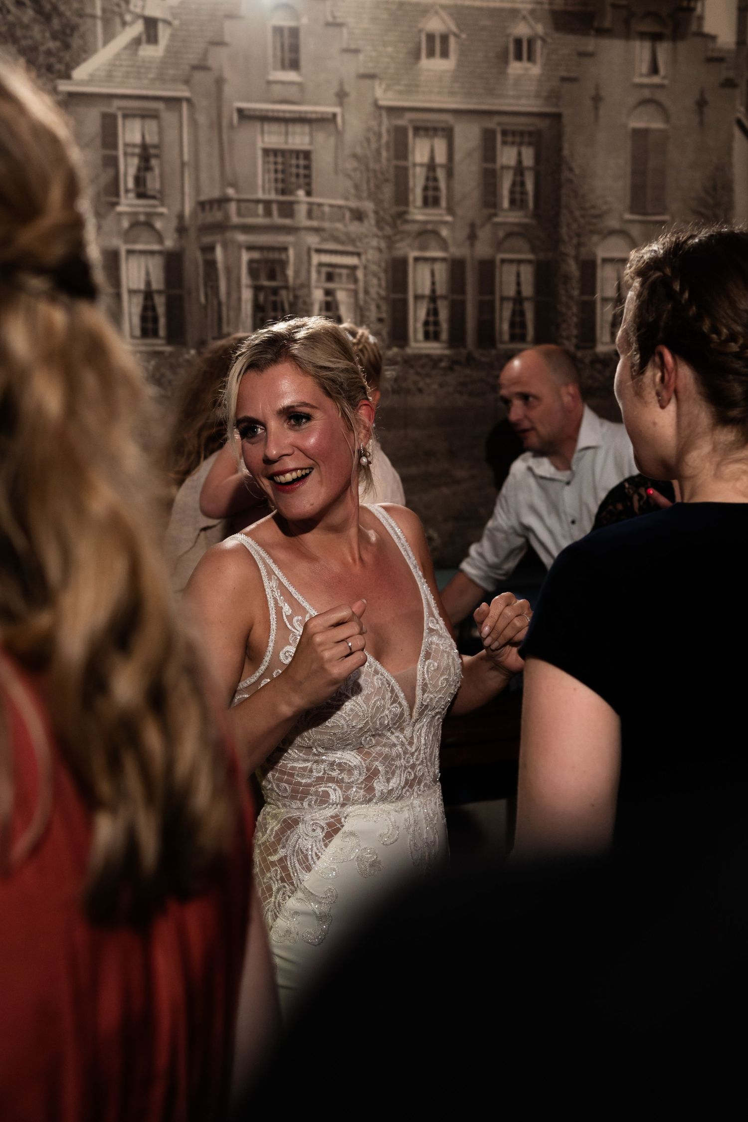 Wedding reception celebration with elegant decor and historic building backdrop.