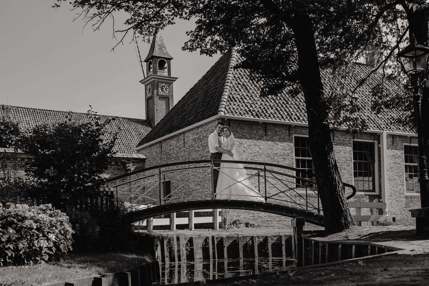 A series of black and white photographs showing historic buildings and structures in a rural setting.