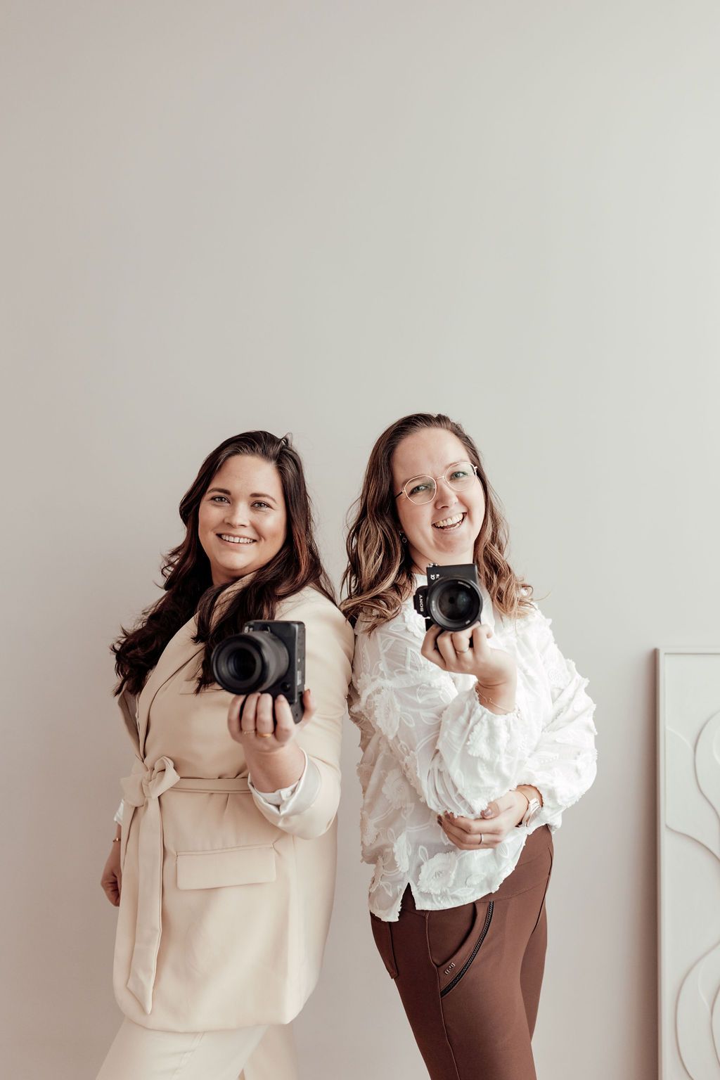 Two people in neutral tones pose together in a series of casual lifestyle photos against a light background.