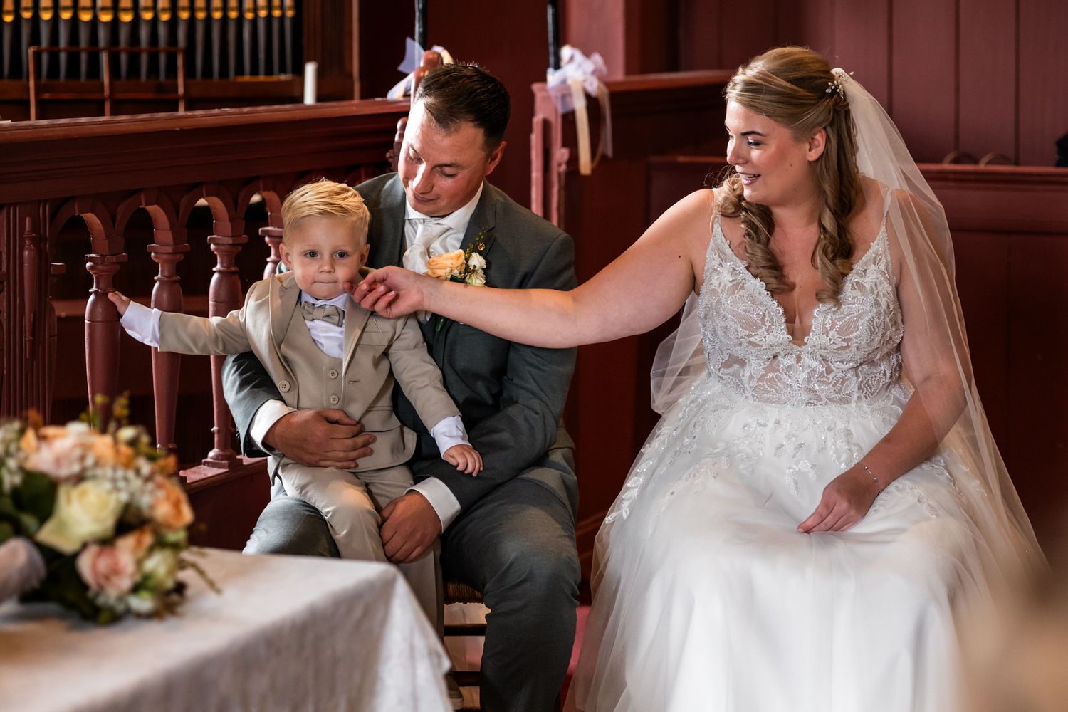 A wedding celebration scene in a church with joyful interactions at the altar.