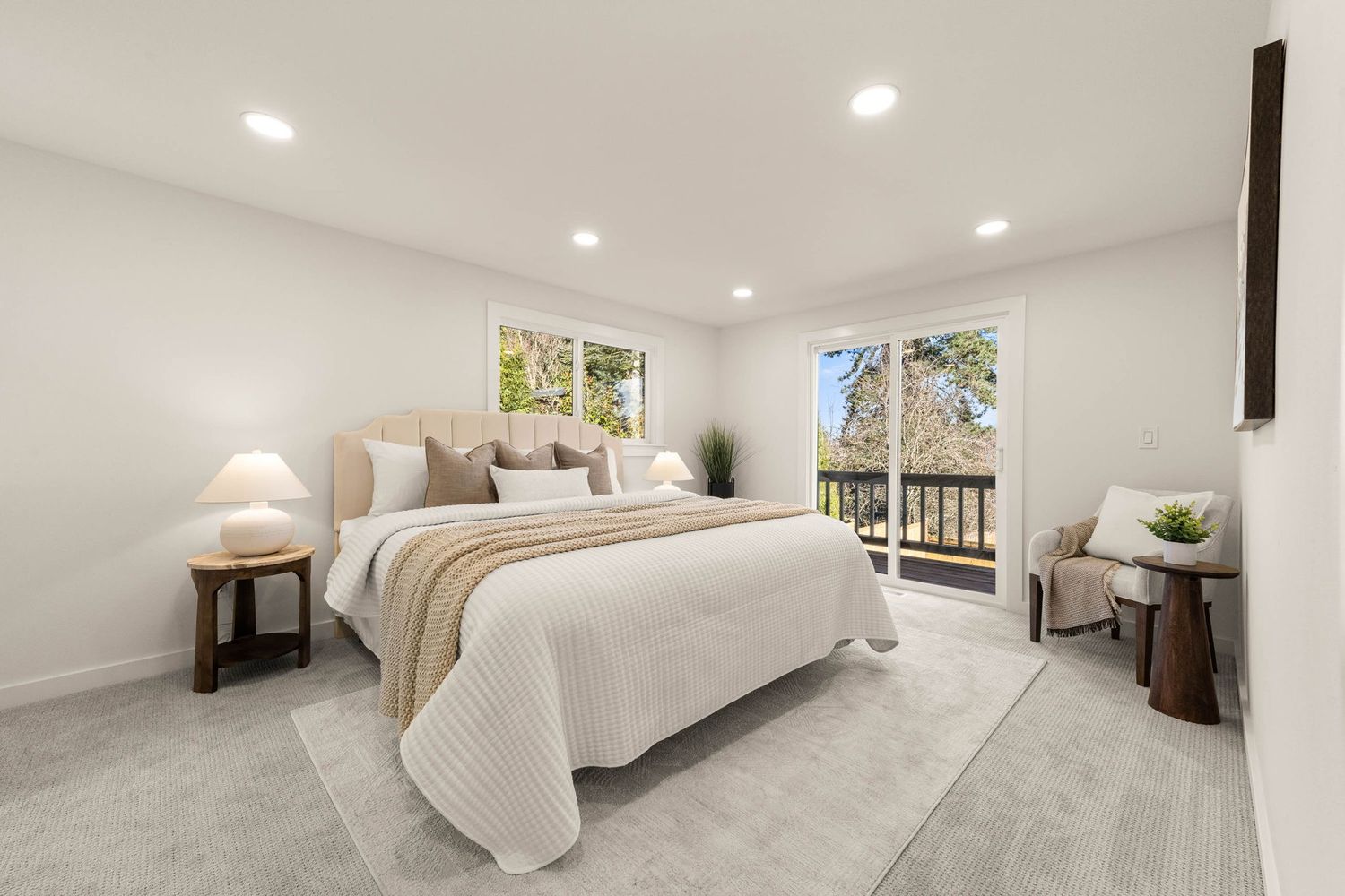 Modern white bedroom interior with wooden floors, recessed lighting, and minimalist decor showcases clean lines and bright spaces.