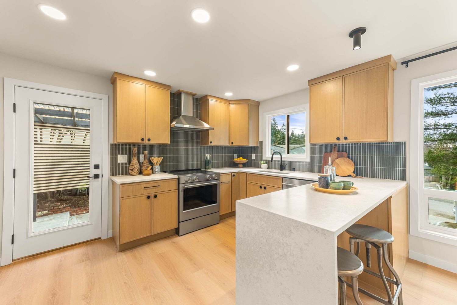 Modern kitchen and living space collage showing white cabinets, recessed lighting, and sleek appliances in various angles.
