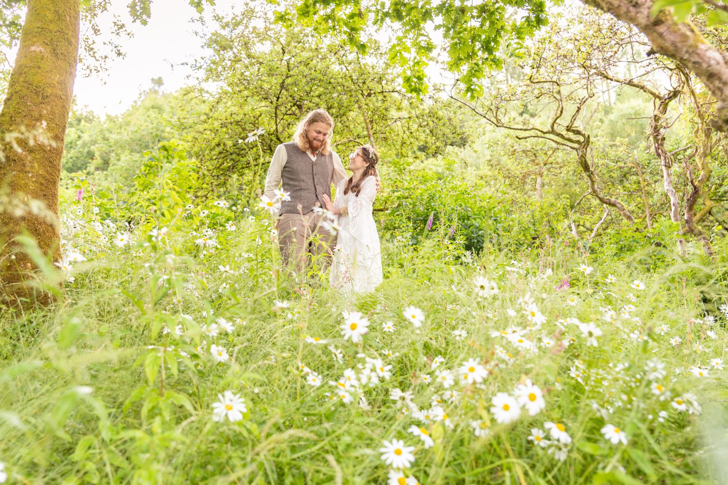 Portrait of a newly married couple among wildflowers. Gwynedd Wedding Photographer