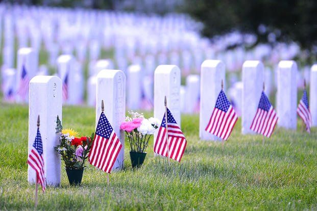 Veterans Memorial Cemetery with flowers and American flags