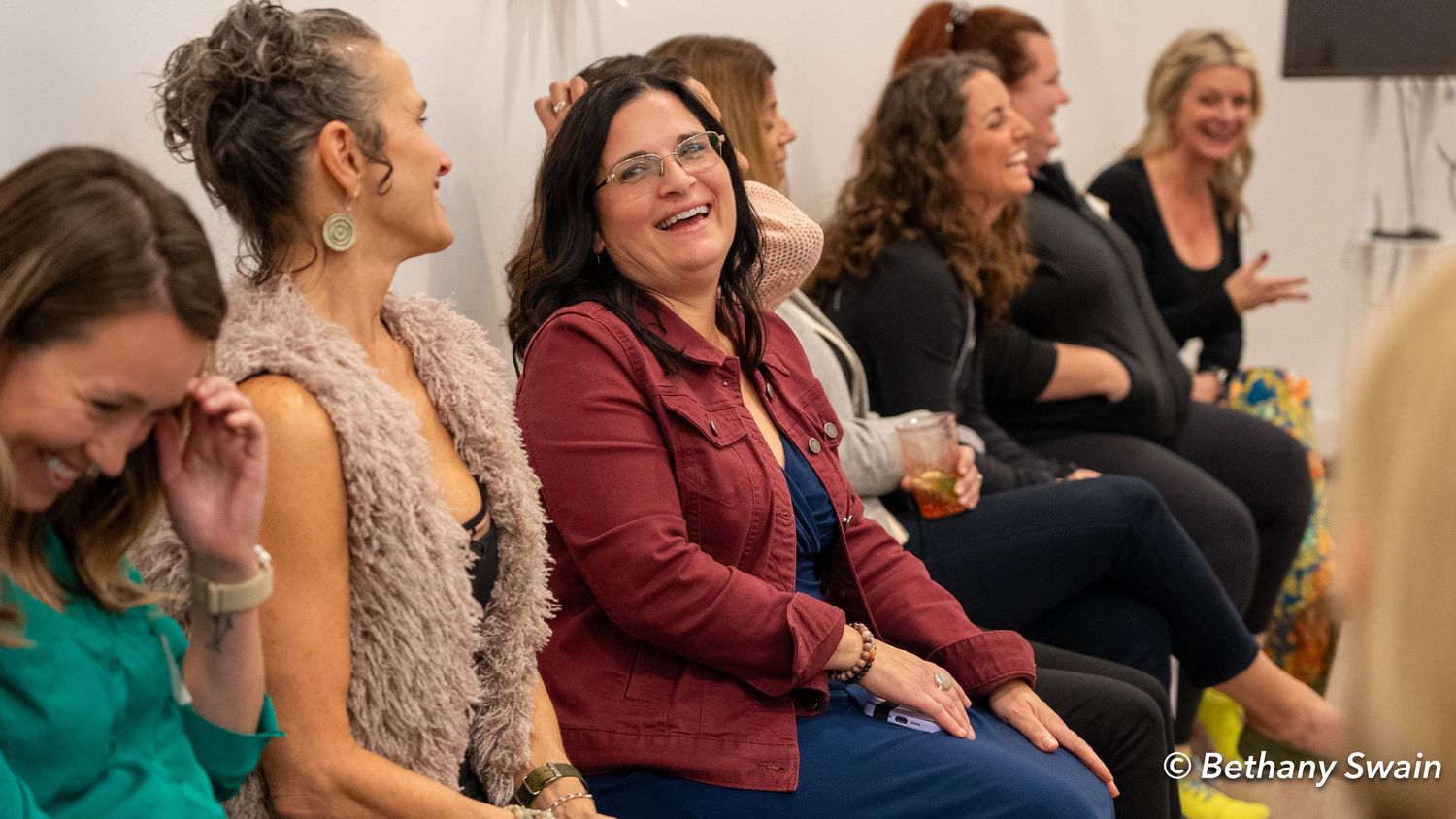 Julie Blamphin and Trish Brewer laugh together during an Emotional Fitness Studio event.