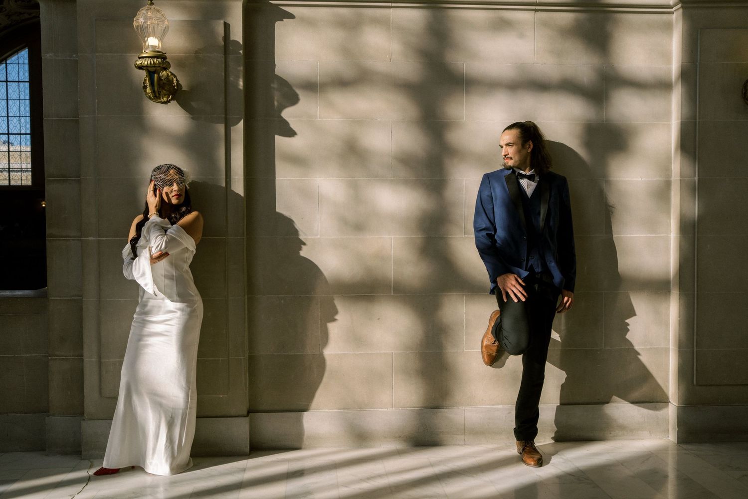 A series of artistic wedding photos showing couples dancing and posing in dramatic window light inside a grand building.