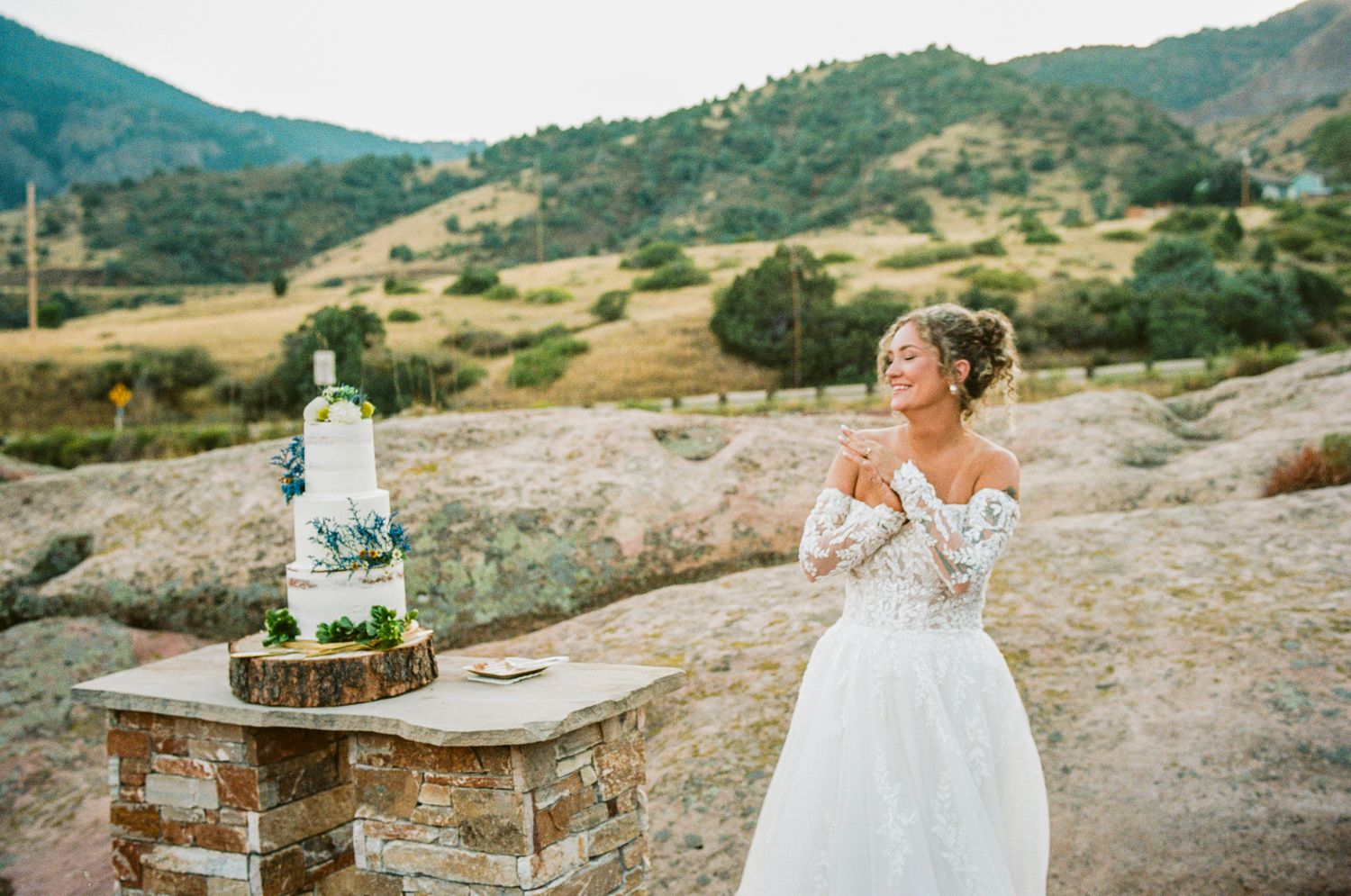Scenic mountain landscape wedding photography with rustic outdoor elements.