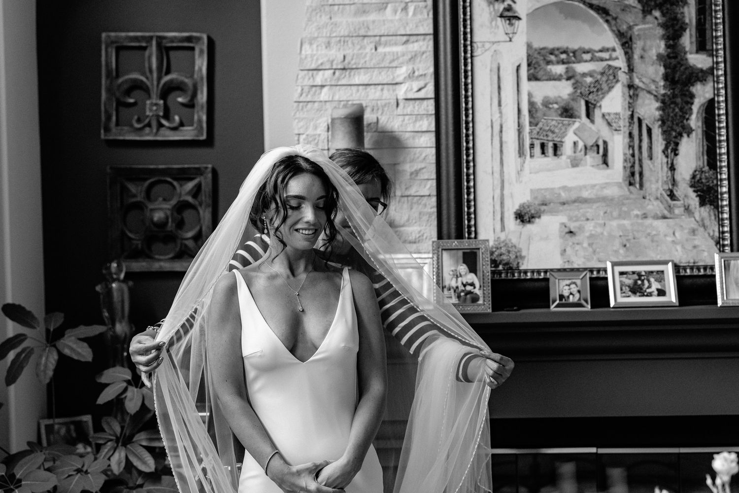 An artistic black and white wedding preparation scene in an interior setting.