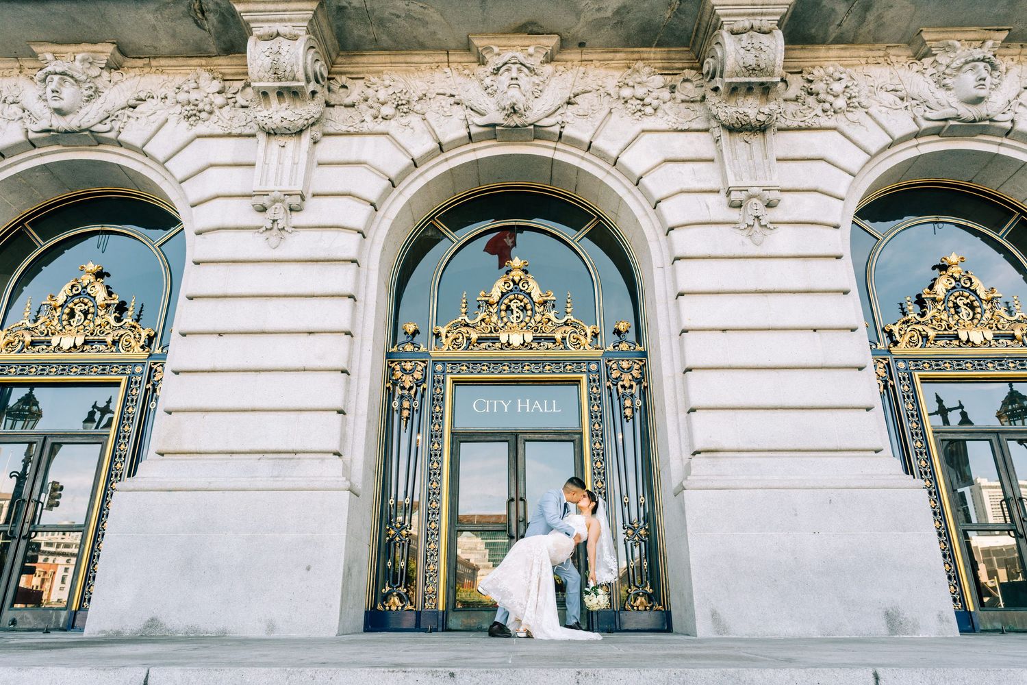 Elegant building exterior with ornamental stonework and multiple arched windows in a row.