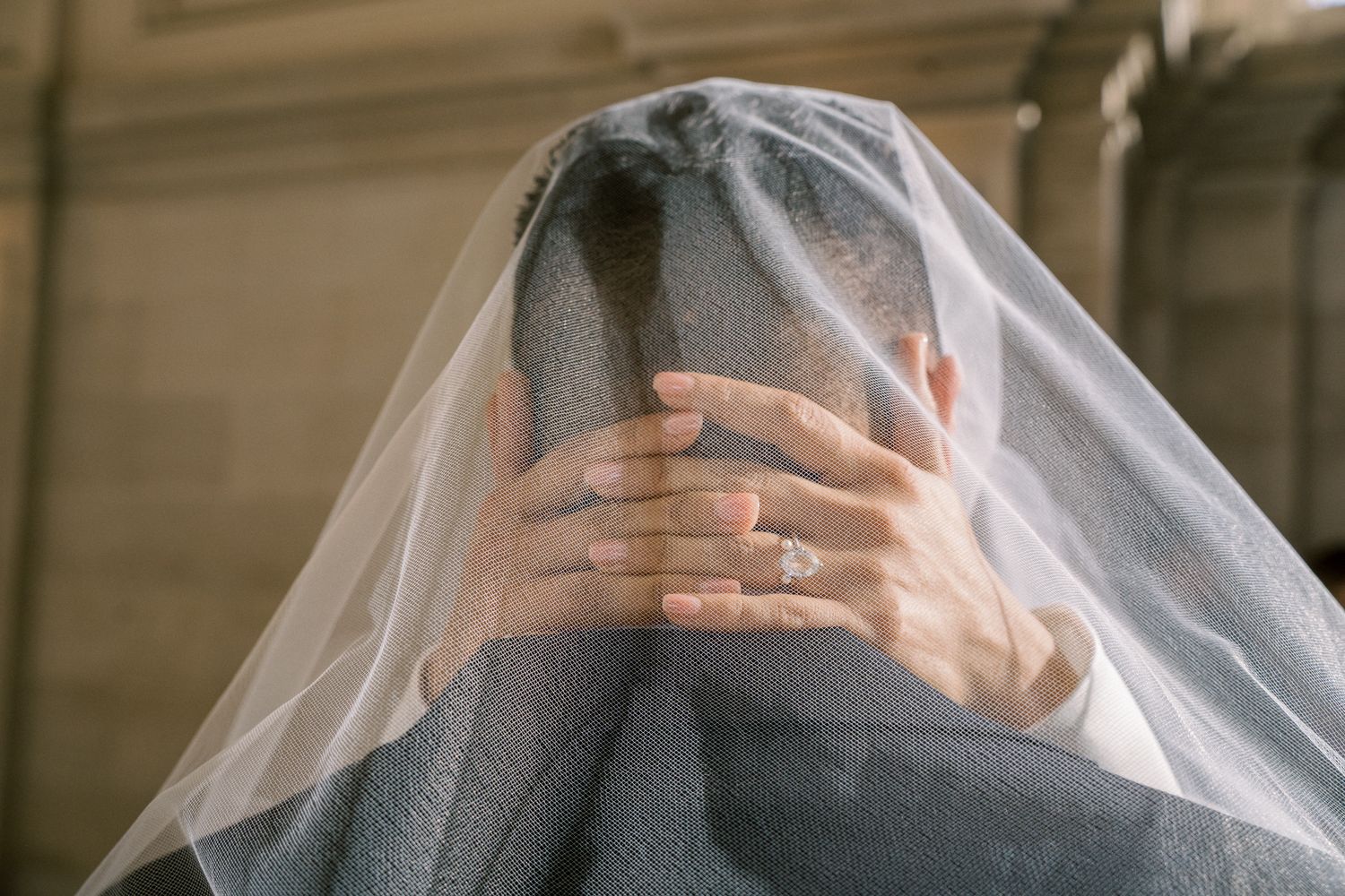 Ethereal bridal portraits with flowing white veil creating romantic atmosphere.