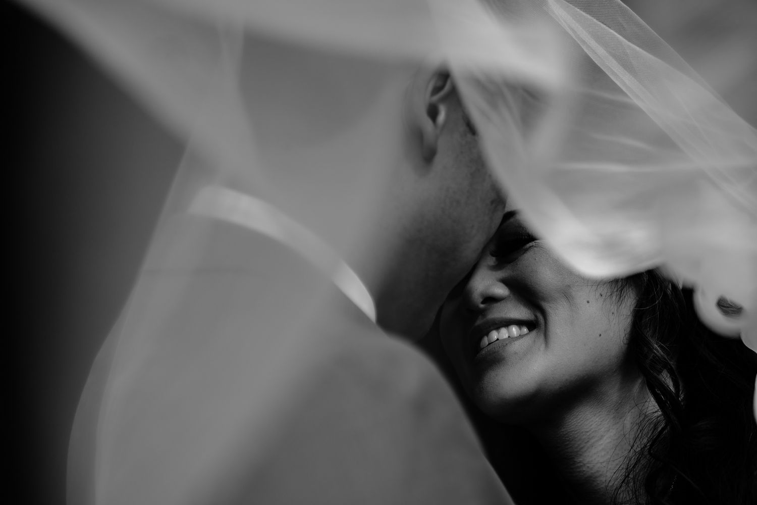 Black and white close-up wedding portraits showing intimate emotional moments.