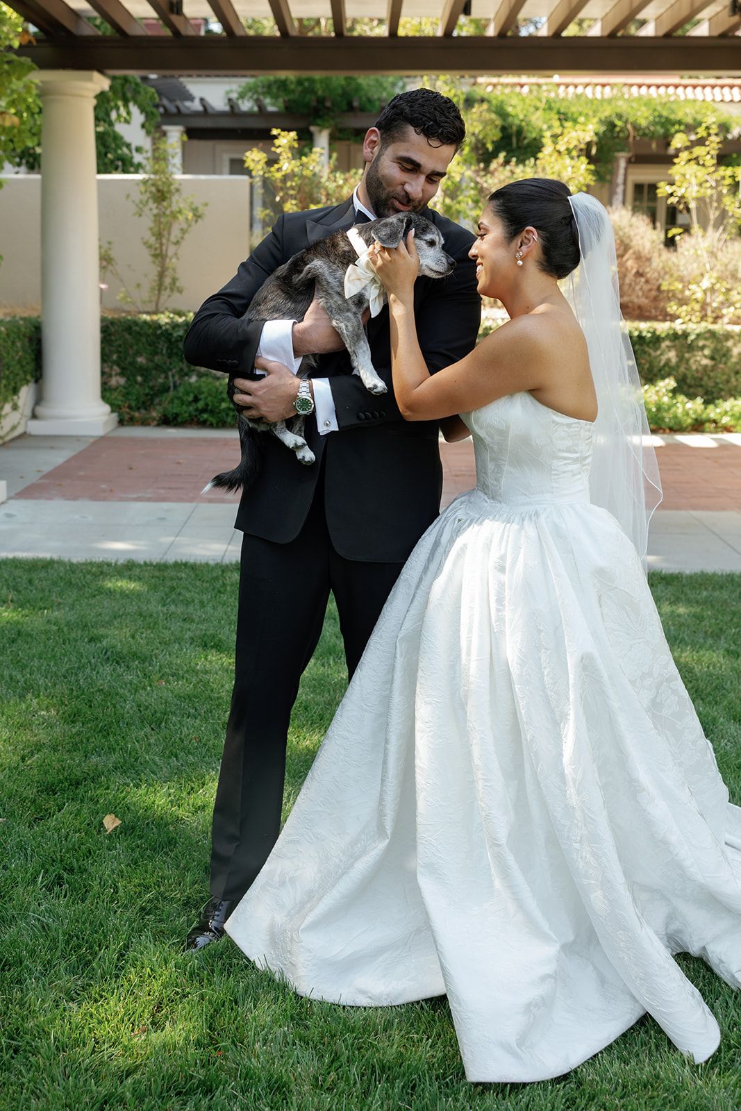 A romantic sequence of wedding photos showing a couple in formal attire dancing and embracing on a manicured lawn.