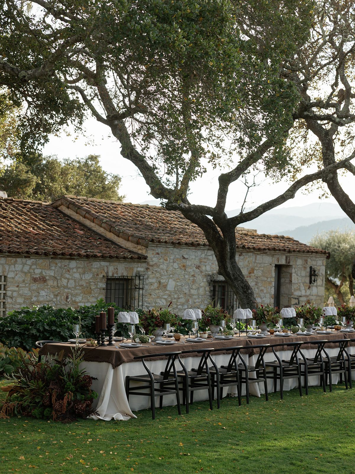 Holman Ranch wedding ceremony in Carmel Valley, California planned by Leilani Donnan Events with vineyard views and historic adobe setting