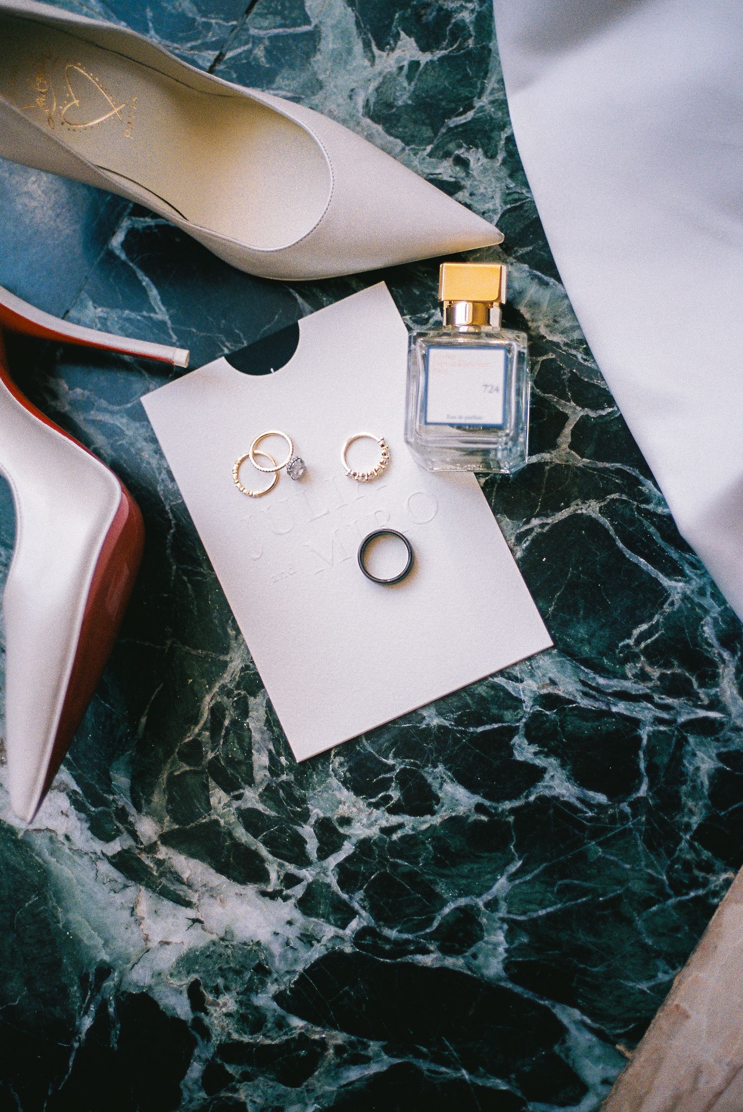 Wedding details, louboutins, wedding rings.
