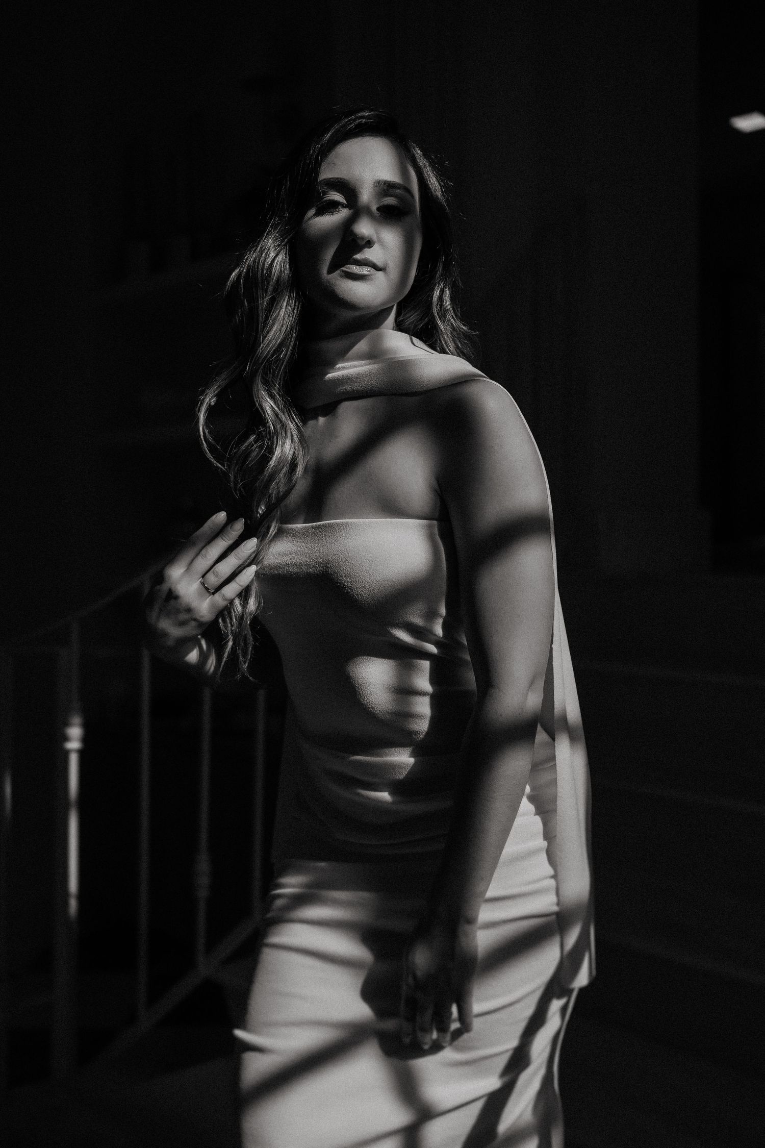 Dramatic black and white portrait series showing a figure in shadow with venetian blind lighting effects.