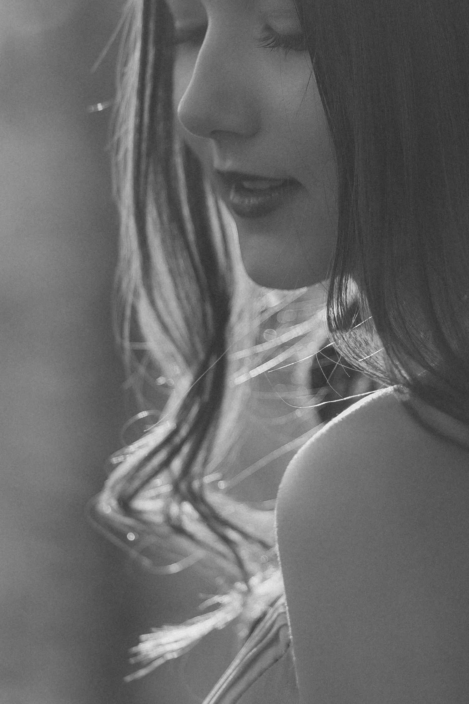 A monochromatic portrait series showing head angles and facial expressions in a soft, dreamy style.