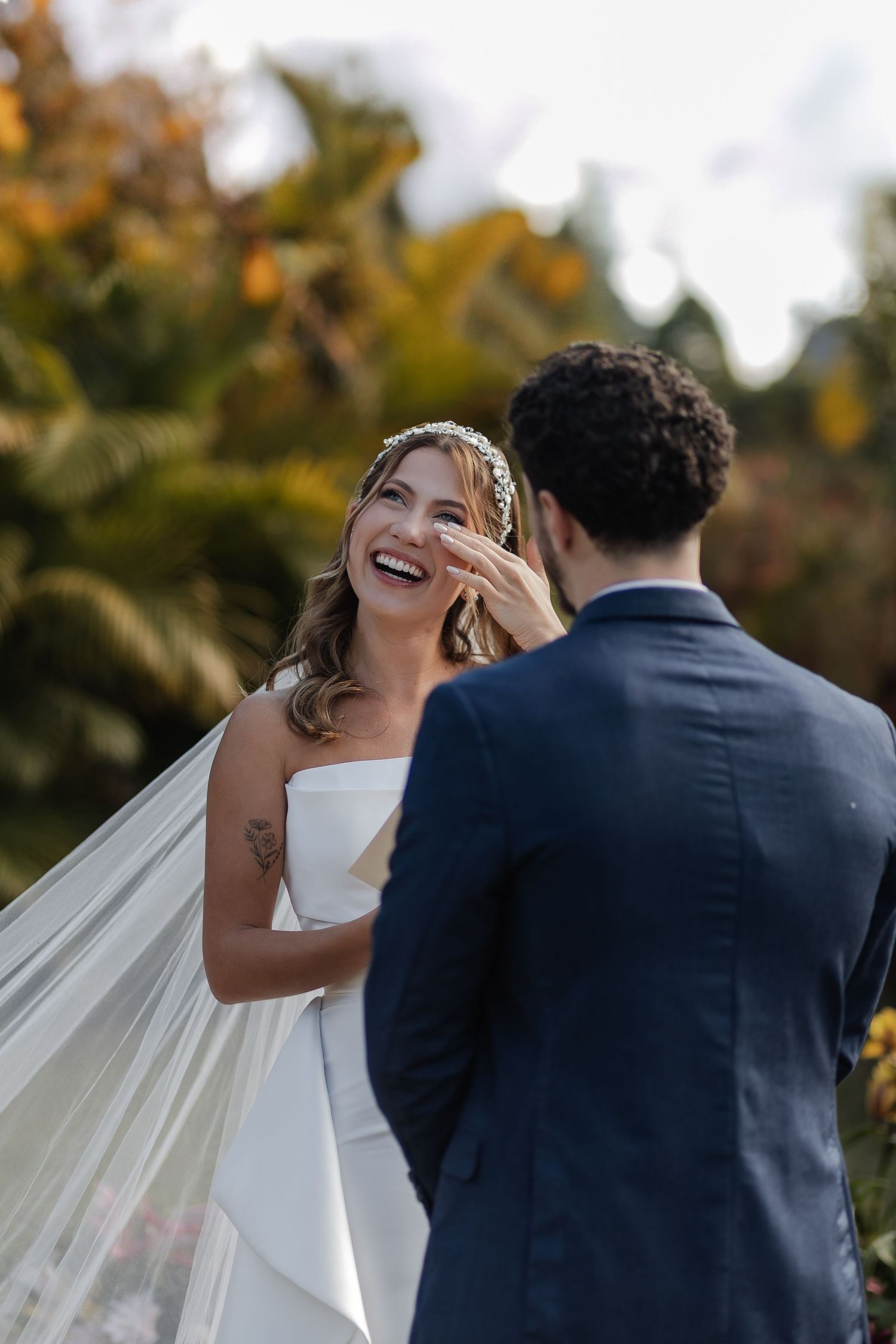 Four connected photos show a joyful wedding moment in an autumn outdoor setting with soft romantic lighting.