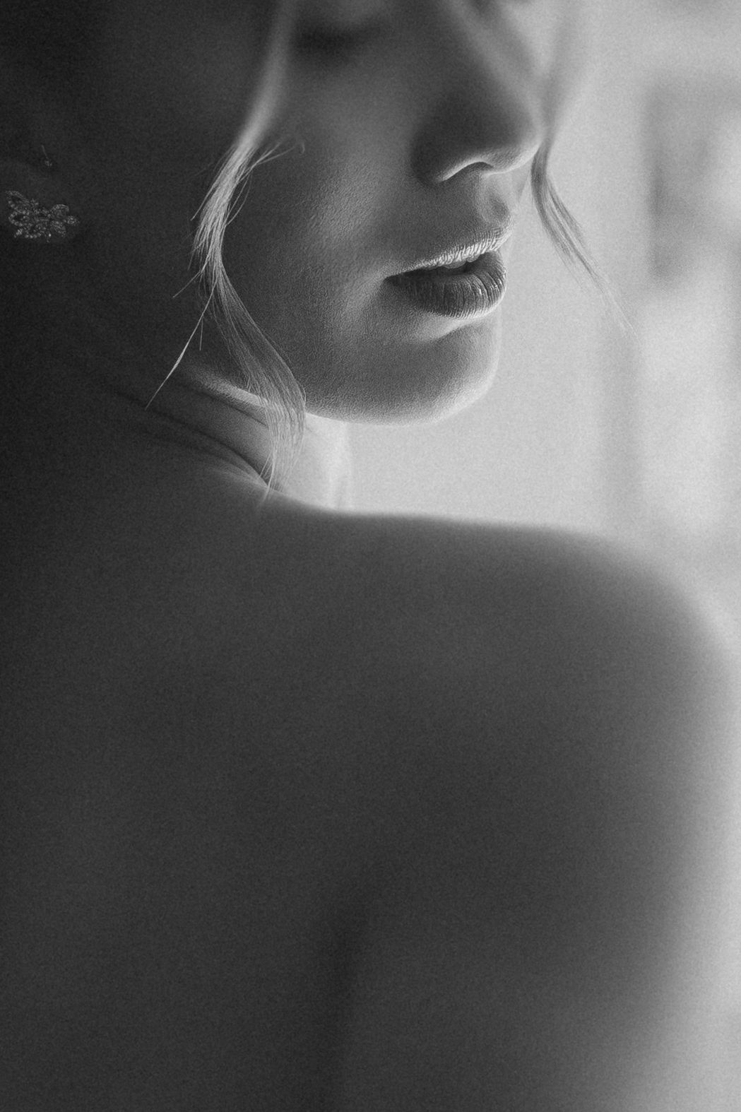 Artistic monochrome portrait sequence showing subtle facial features and shadows in black and white close-ups.