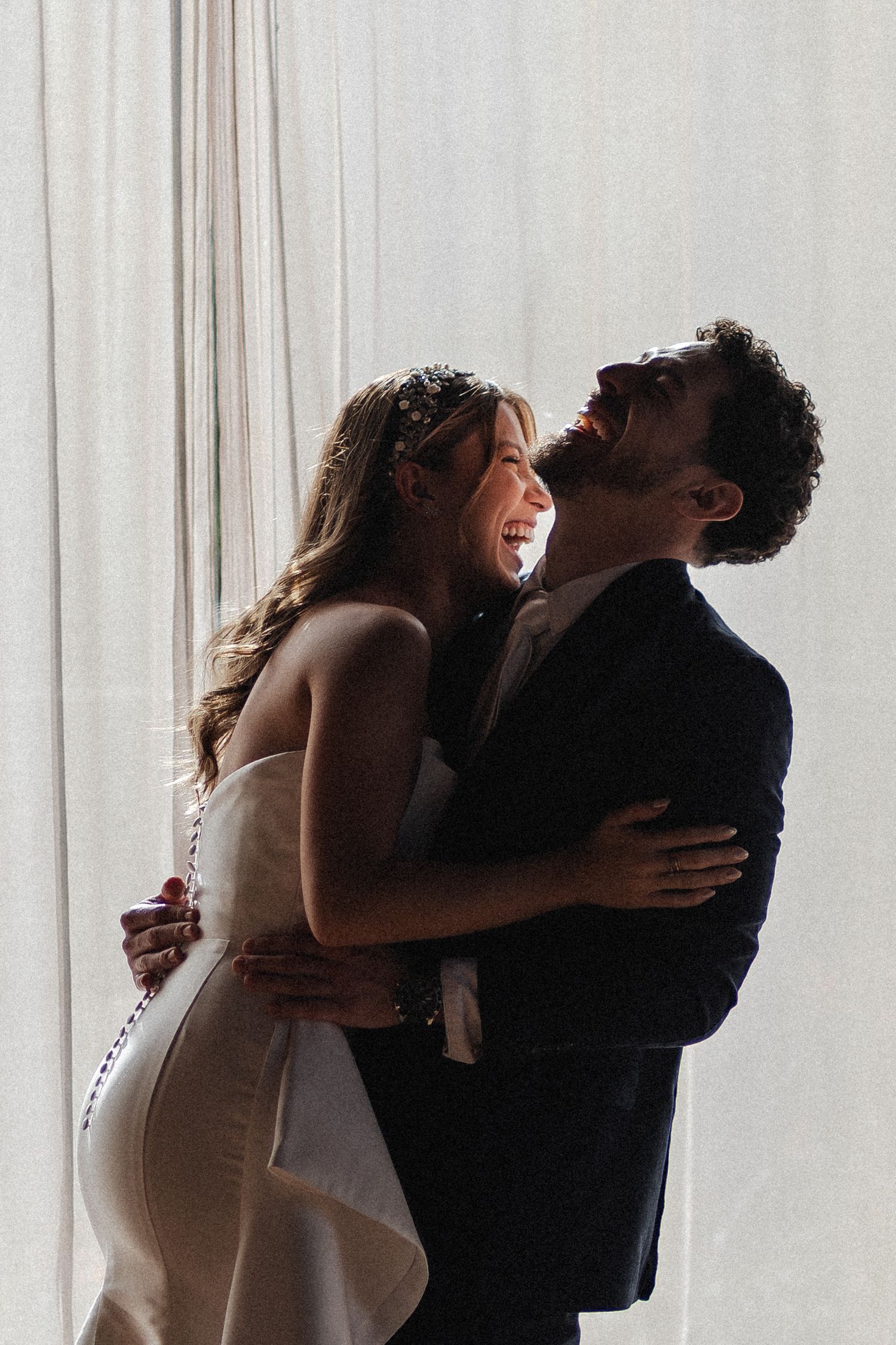 A romantic sequence of photos shows a couple embracing and sharing intimate moments in front of a bright window.