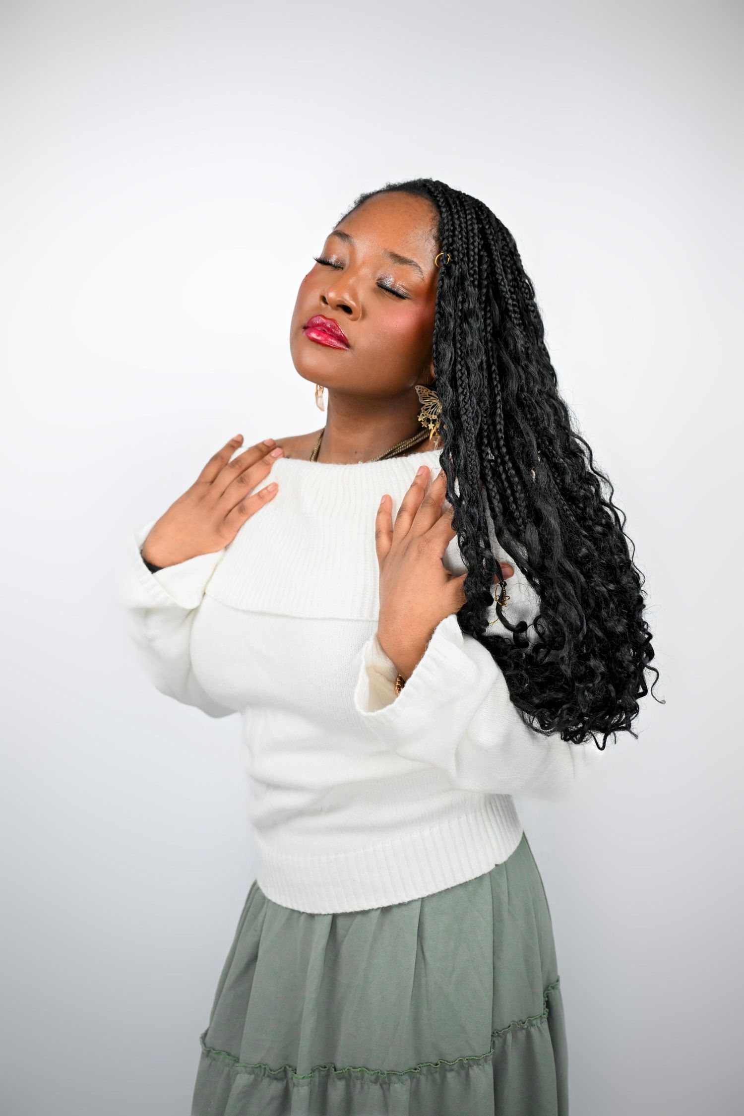 Expressive poses of a person in white sweater and grey skirt with flowing black braids.