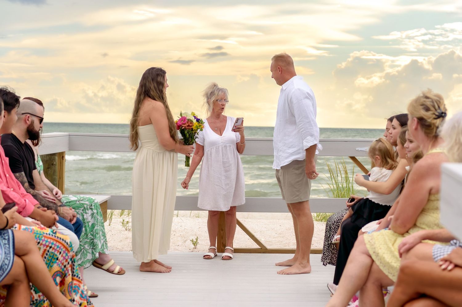 A series of beach wedding photos showing intimate moments between couples during a sunset ceremony by the ocean.