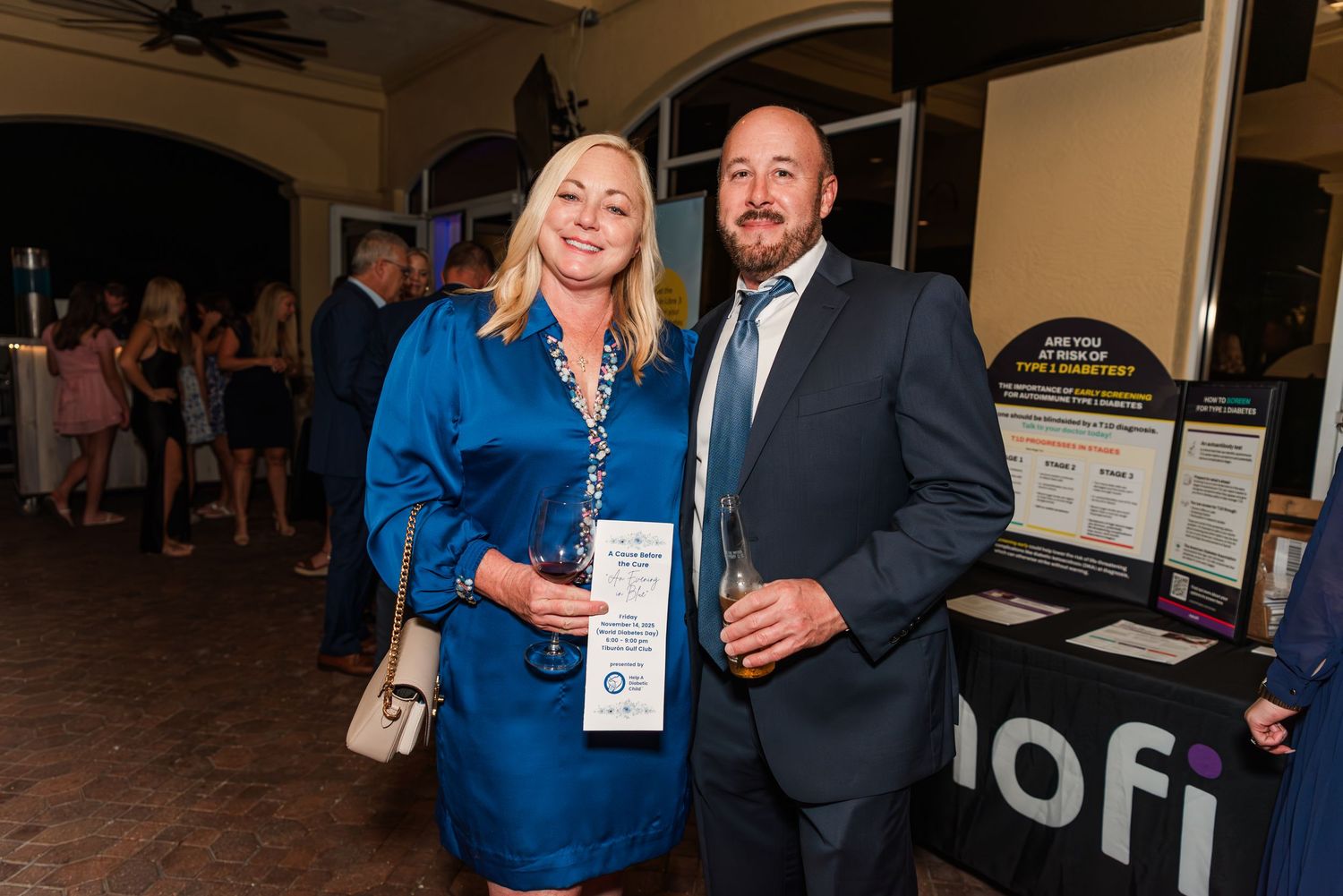 A group of attendees mingle and network at a professional conference or business event.