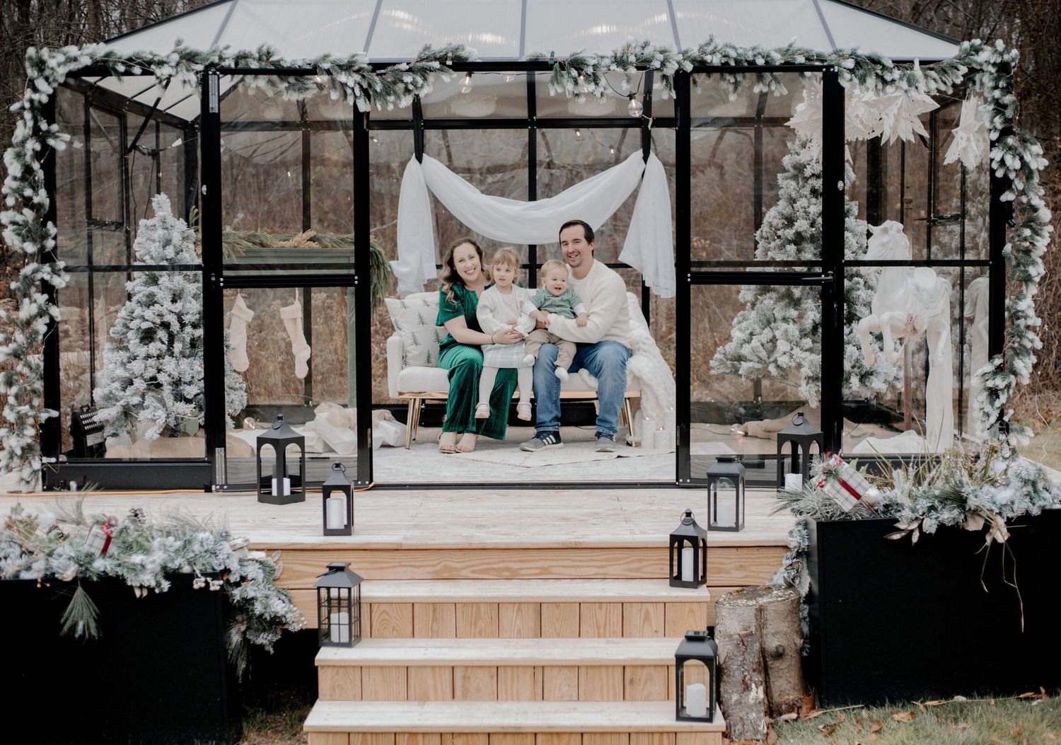 Winter holiday scene with decorated gazebo and frosted trees creating a magical atmosphere.