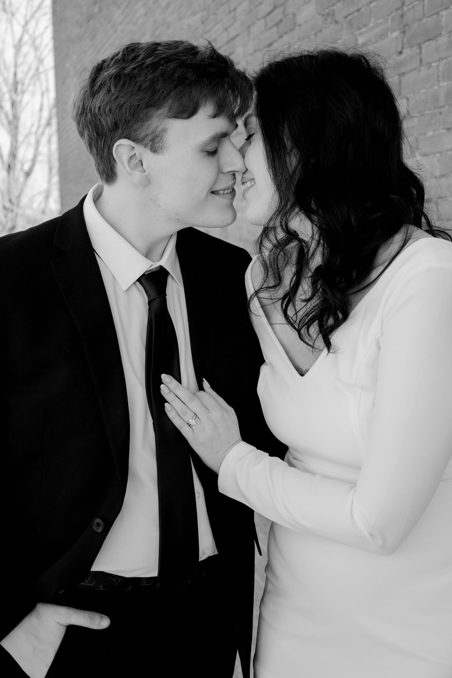 Black and white intimate portrait series showing gentle affection and closeness.