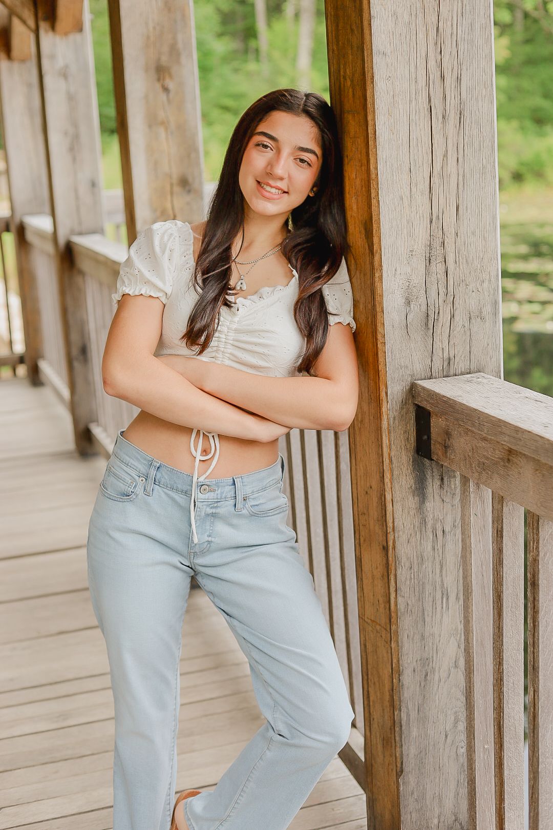 Casual portraits on a rustic wooden porch with natural lighting.