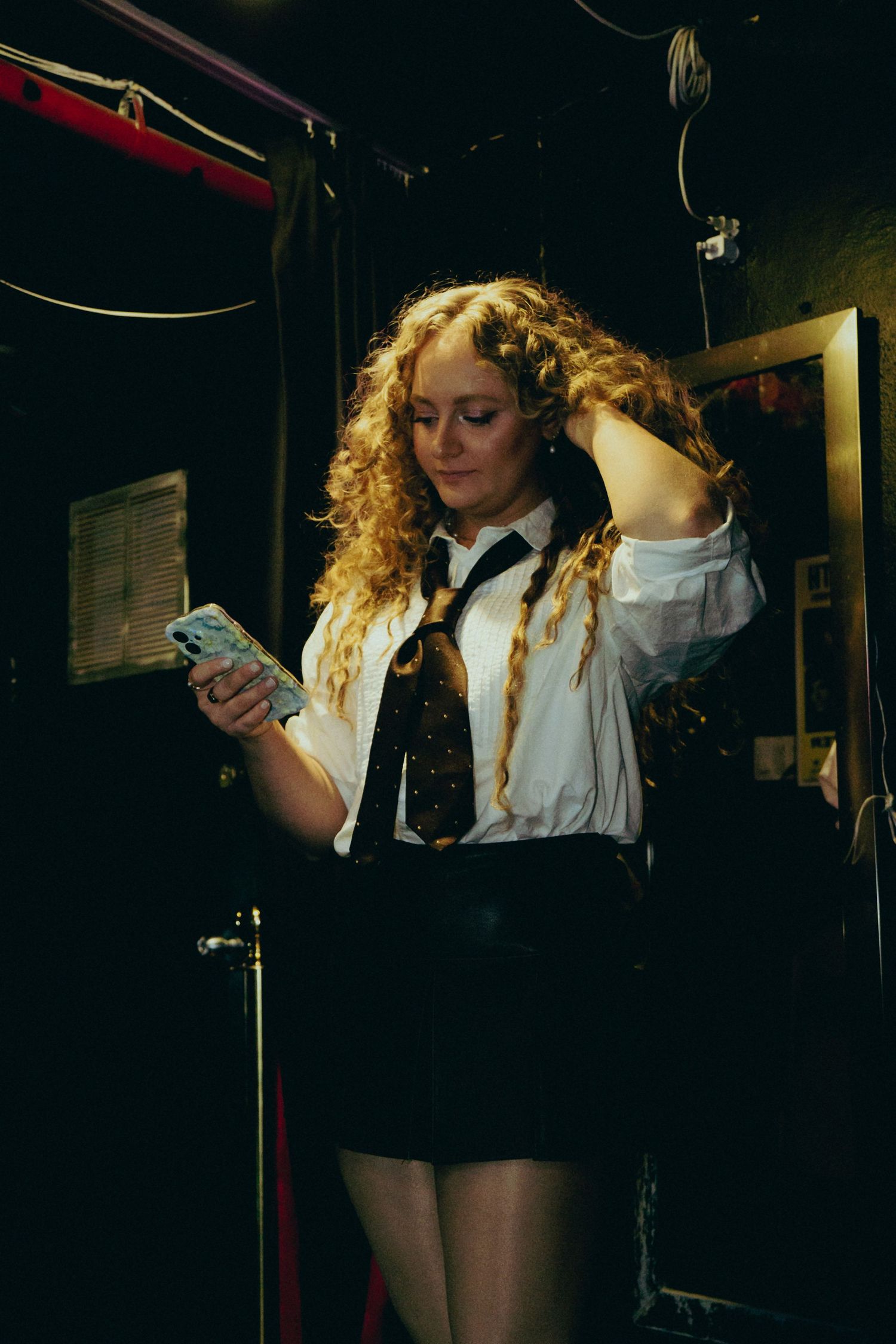 Candid behind-the-scenes photo of artist preparation and stage setup before a live performance in NYC