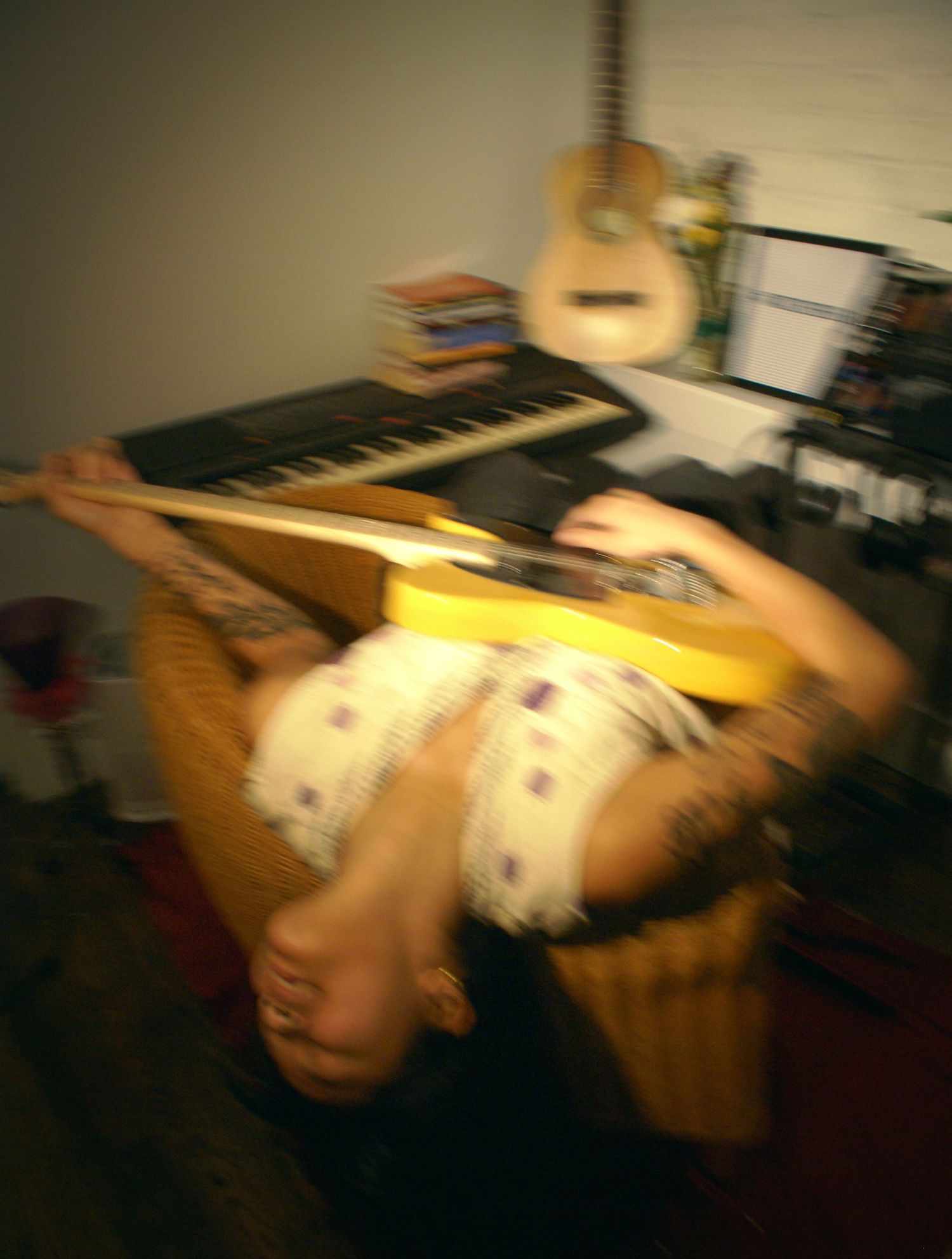 Moody editorial portrait of a young woman with guitar