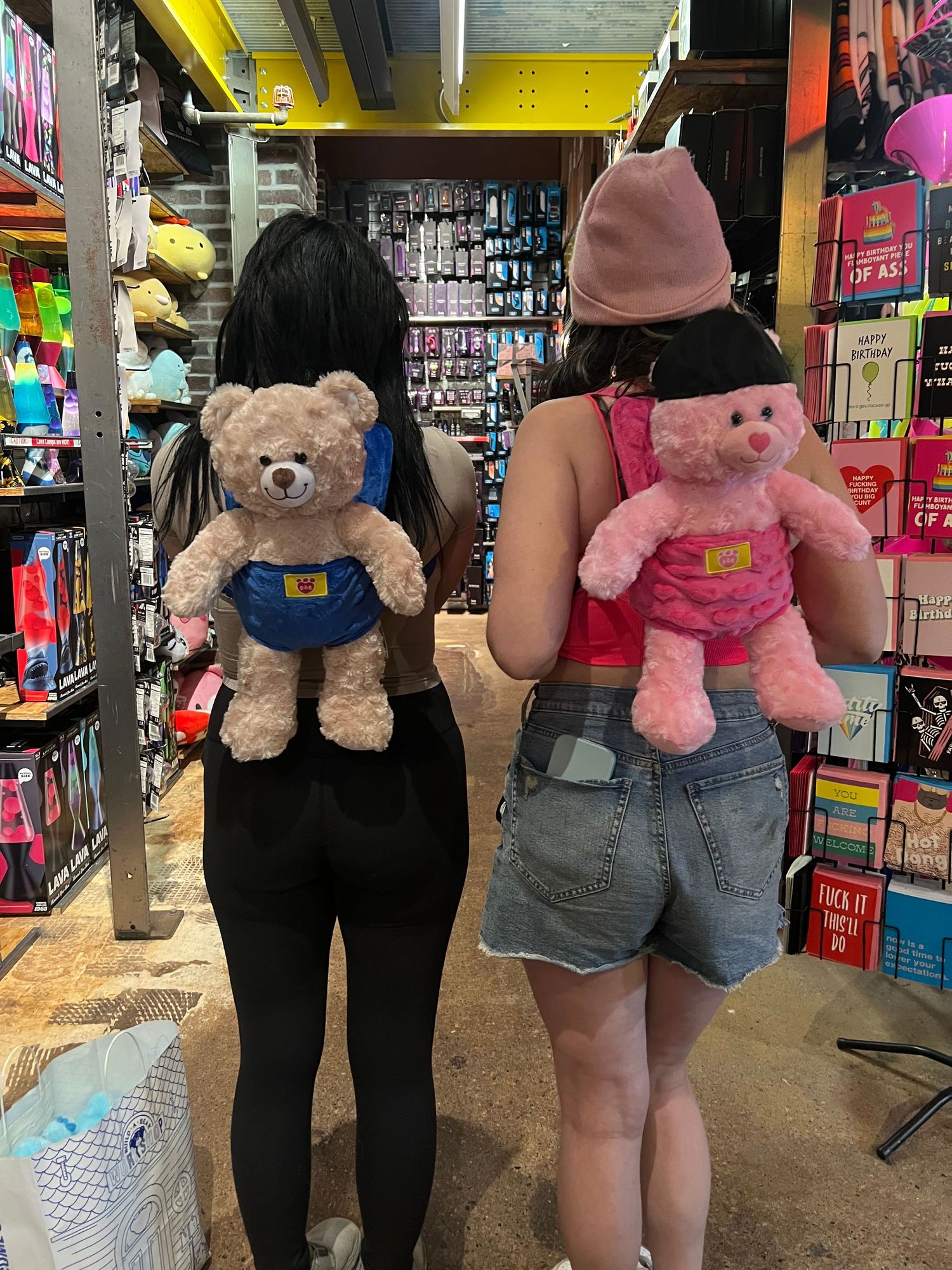 owner Julianna amado and her sister Lilly Mand posing with their urn stuffed bears