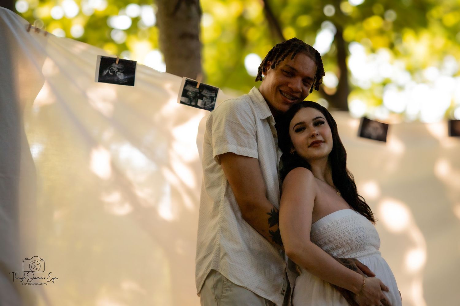 Madeline and Dsean maternity session photography portraits couples grey skies collective albums
