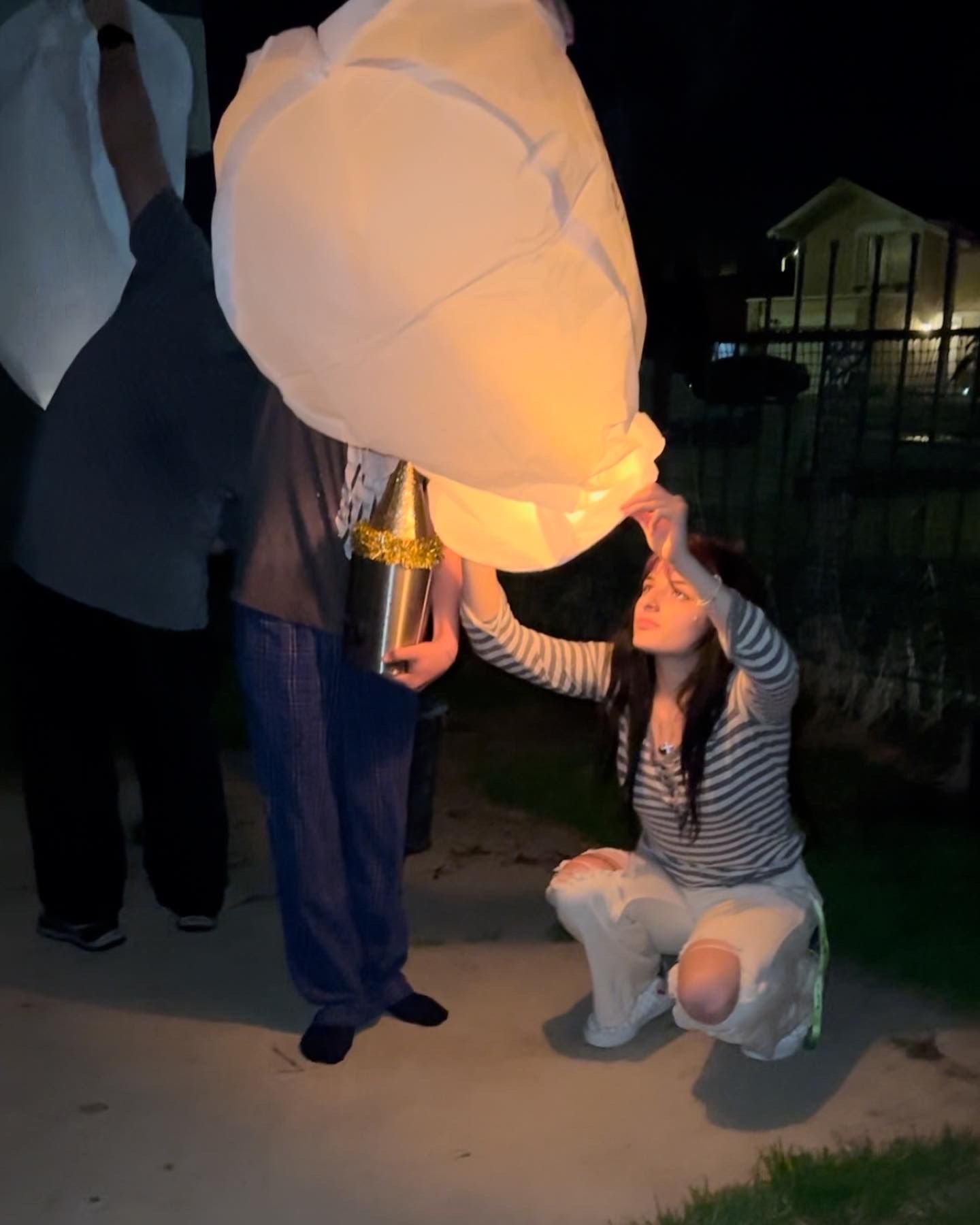 owner Julianna amado lighting tribute memorial lantern for father Jamies amados birthday
