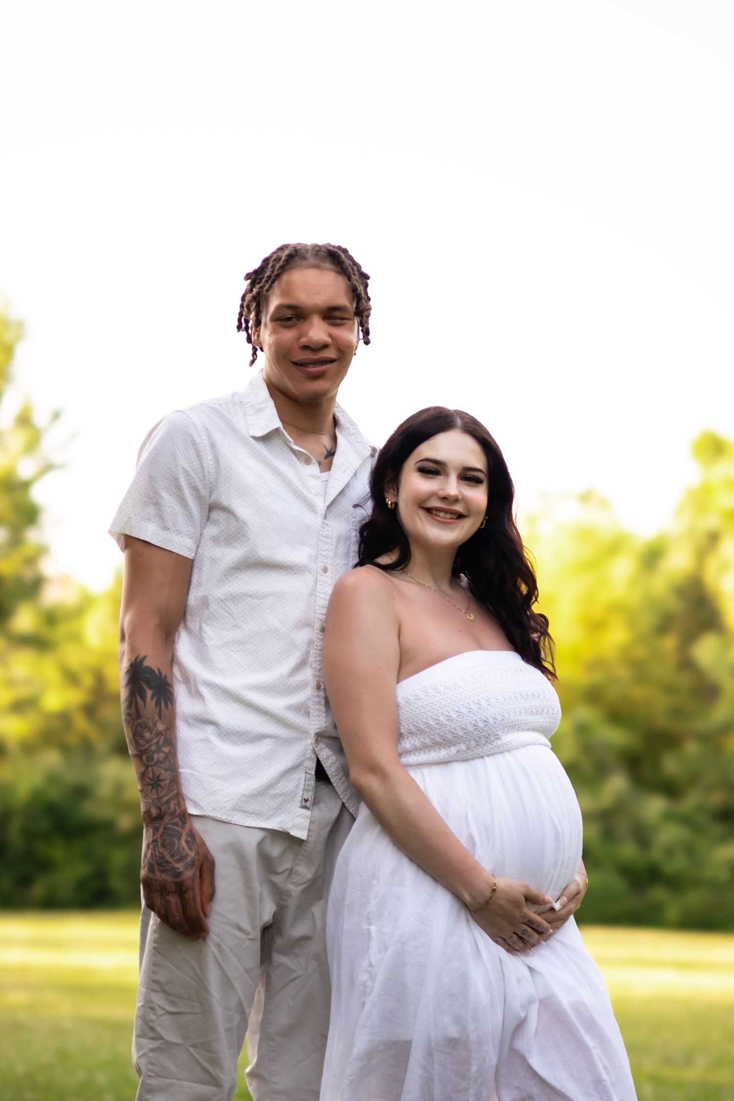 Madeline and Dsean maternity session photography portraits couples grey skies collective albums