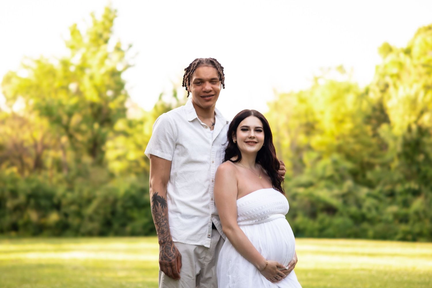 Madeline and Dsean maternity session photography portraits couples grey skies collective albums