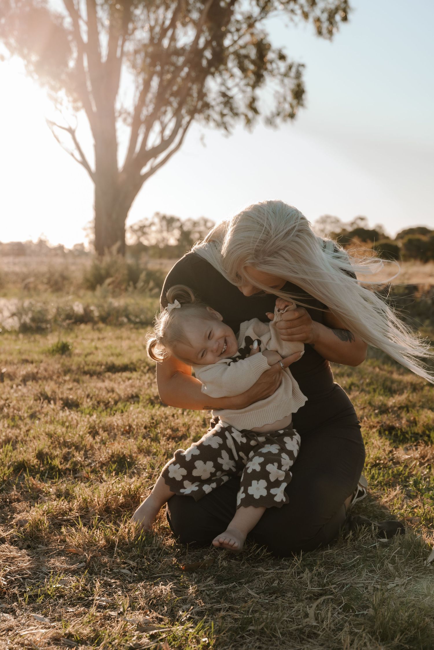 family-playing-in-field-during-golden-hour-tongala