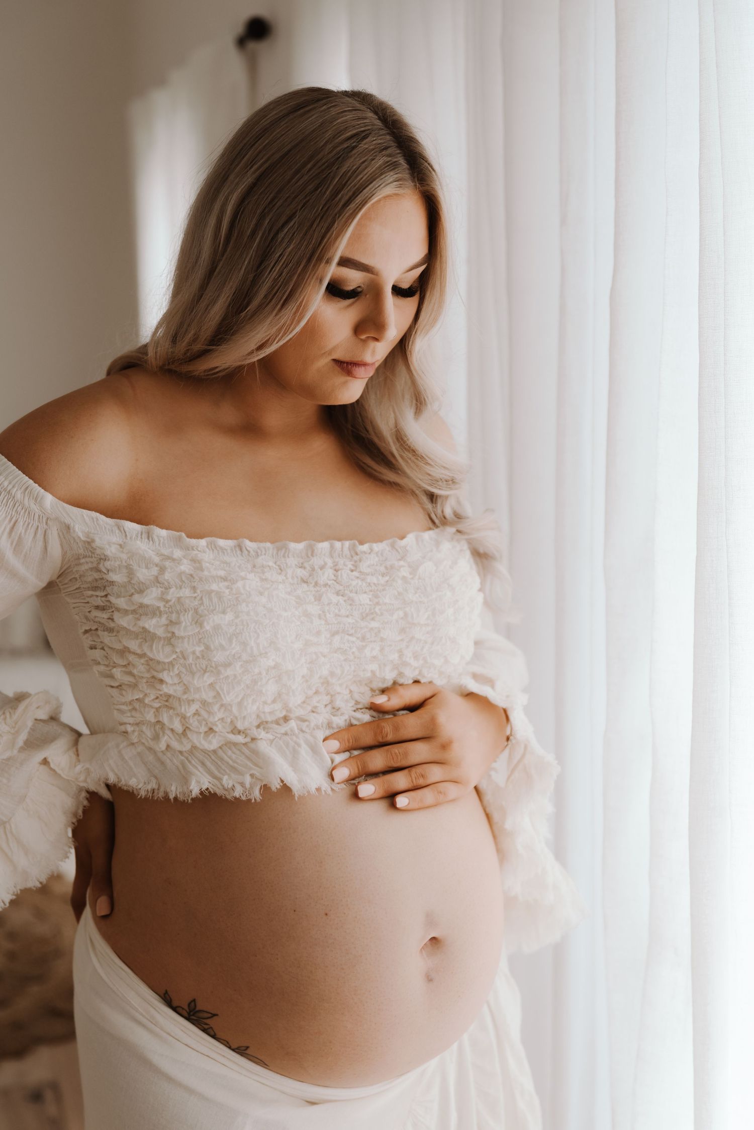 pregnant-mother-standing-in-studio-tongala