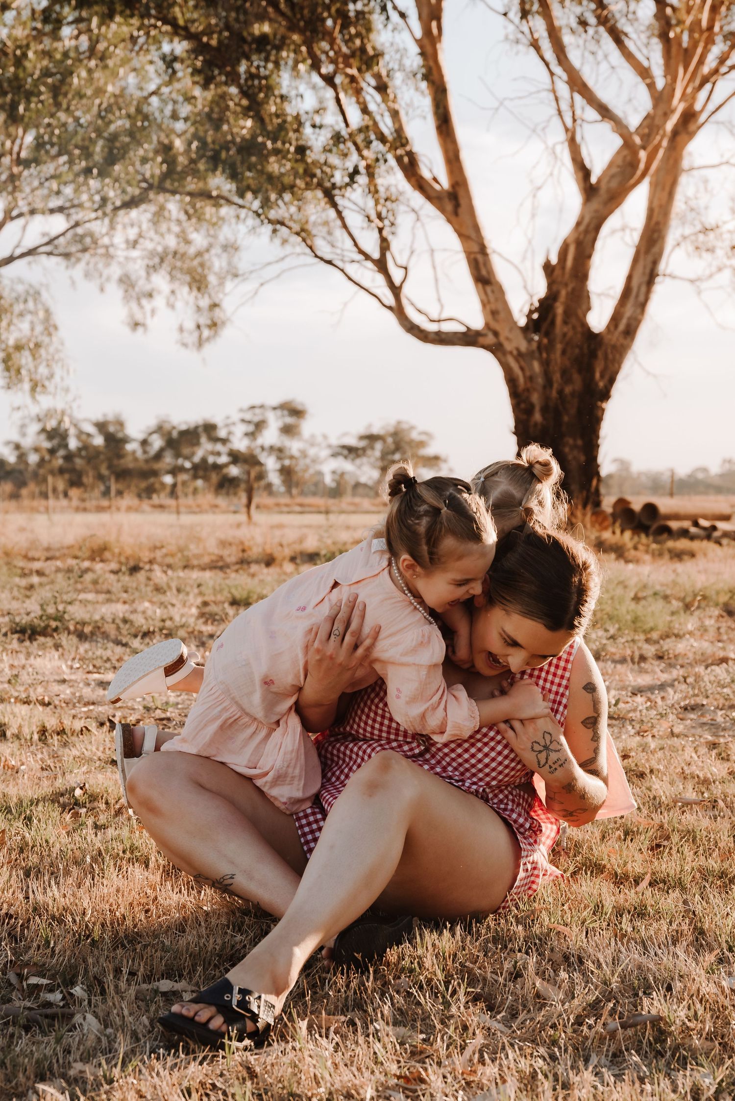 family-playing-in-field-during-golden-hour-tongala