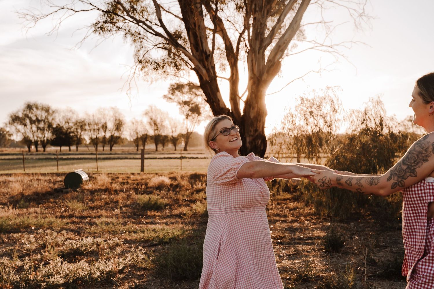 family-playing-in-field-during-golden-hour-tongala