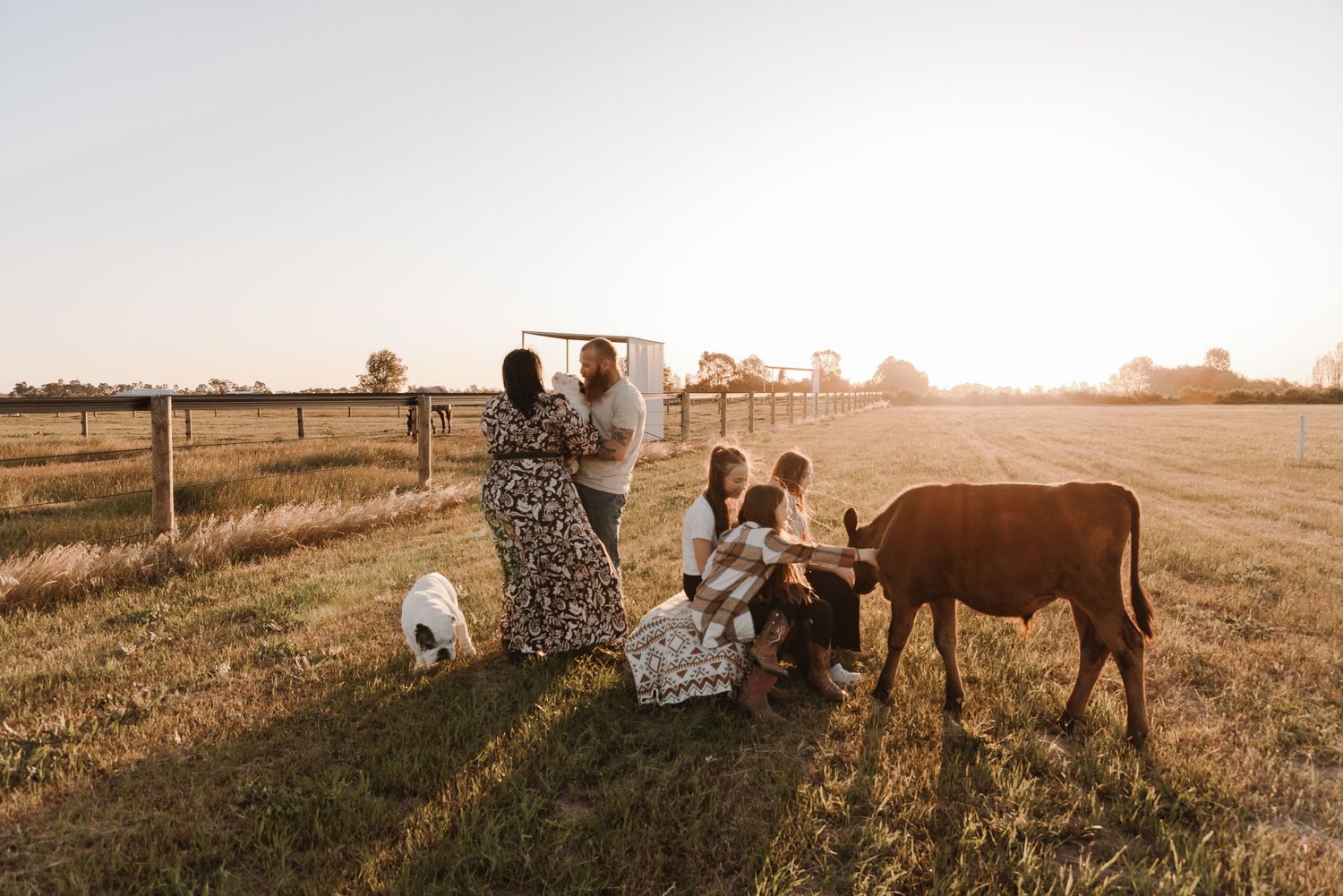 family-playing-in-field-during-golden-hour-tongala