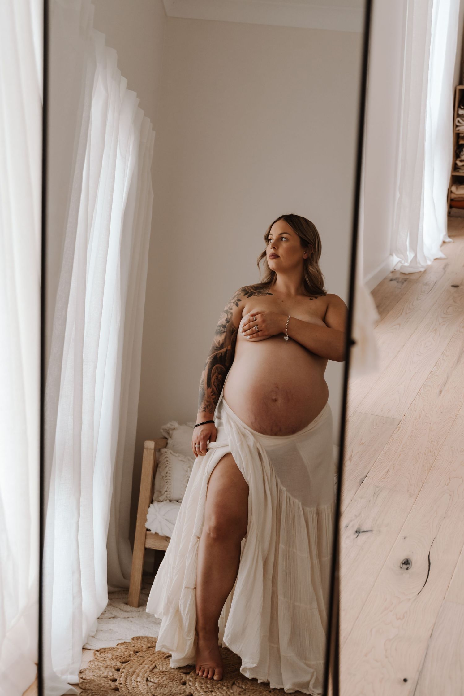 pregnant-mother-showing-off-baby-bump-tongala
