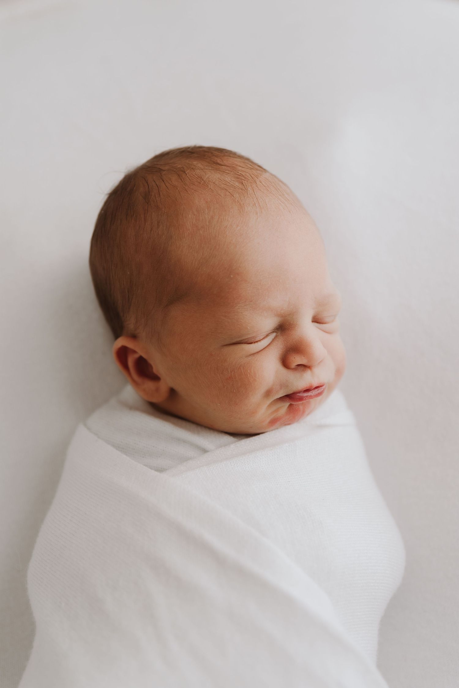 tongala-newborn-photography-newborn-baby-wrapped-in-neutral-blanket-tongala