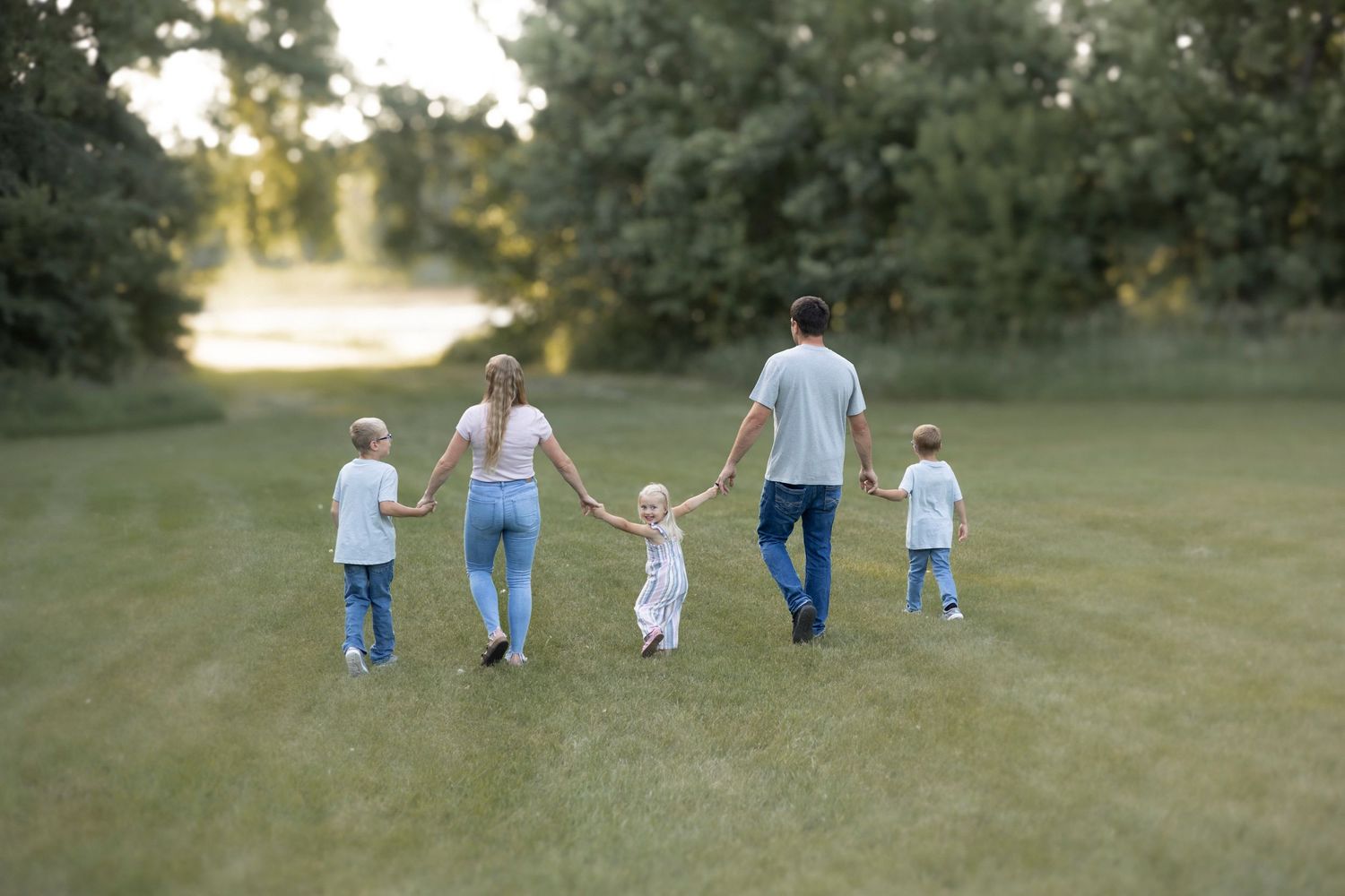 family holding hands grand forks
