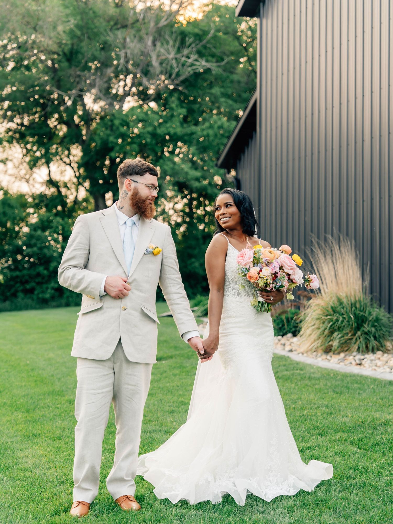 A wedding couple stands together in a field at sunset, laughing and embracing in loving moments across three candid photos.